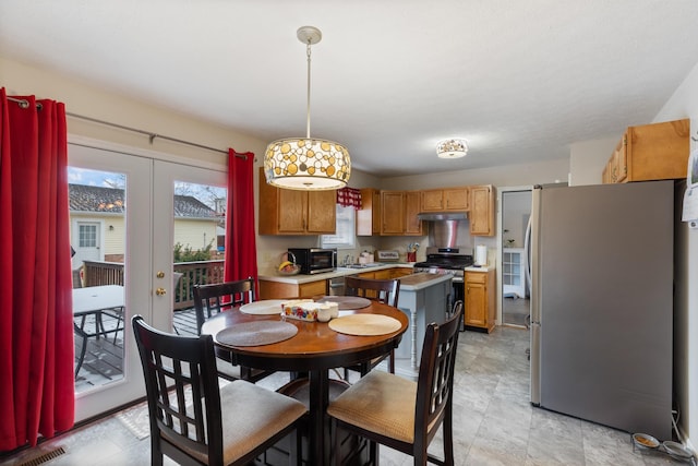 dining room with french doors and sink