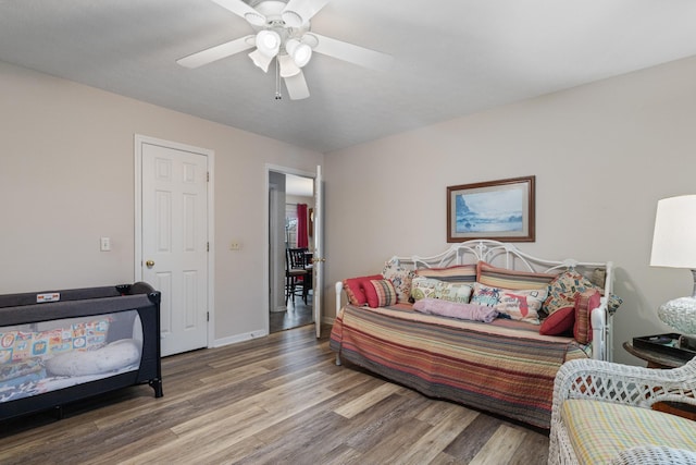 bedroom with ceiling fan and wood-type flooring