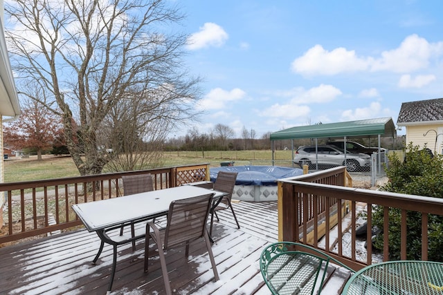 wooden terrace with a covered pool