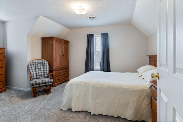 bedroom with light colored carpet, a textured ceiling, and vaulted ceiling