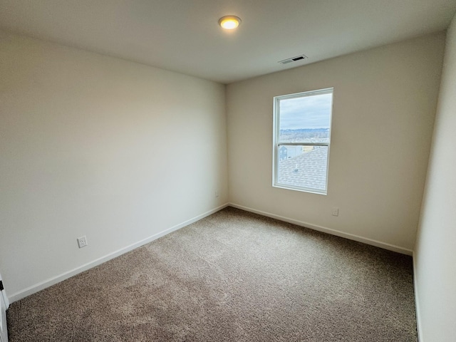 unfurnished room featuring carpet