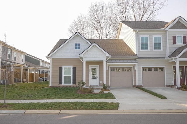 view of front facade featuring a garage and a front lawn