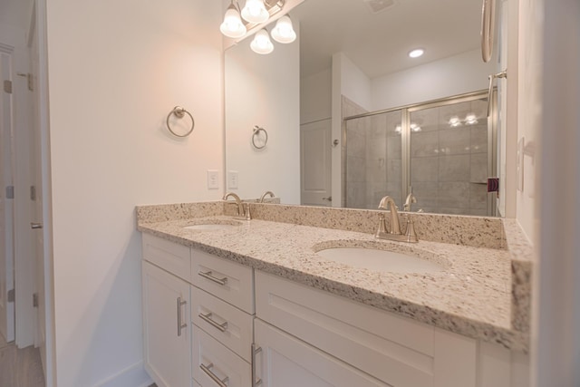 bathroom featuring vanity and walk in shower