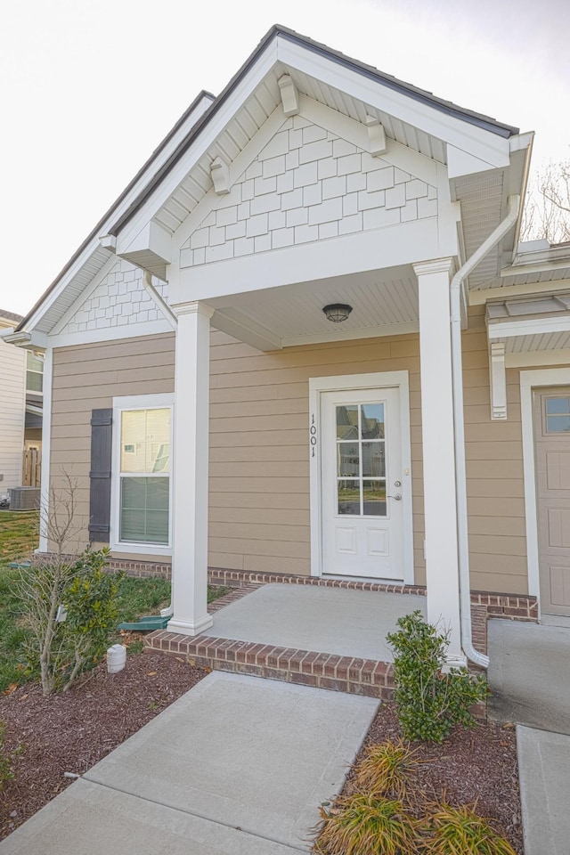 property entrance featuring a porch