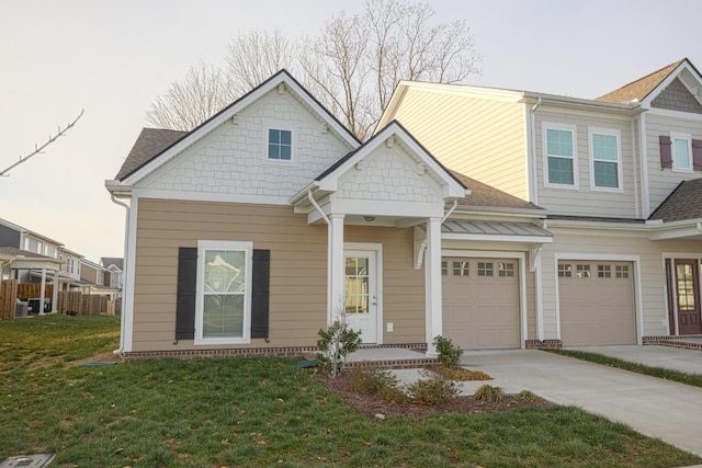 view of front facade featuring a front lawn and a garage