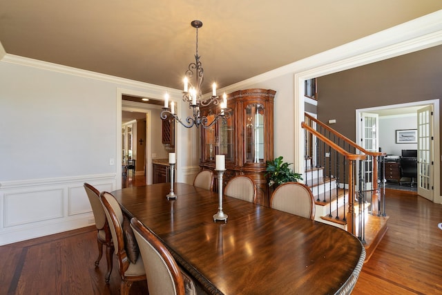 dining room featuring french doors, a chandelier, dark hardwood / wood-style floors, and ornamental molding