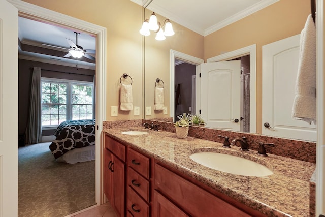 bathroom with tile patterned floors, crown molding, vanity, and ceiling fan with notable chandelier