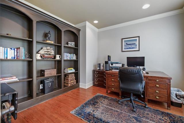 office area featuring hardwood / wood-style flooring and crown molding