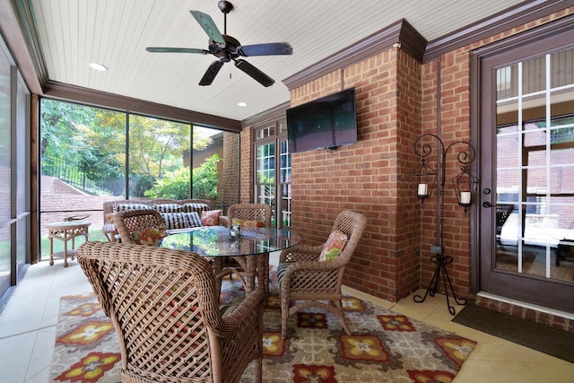 sunroom / solarium featuring ceiling fan and wood ceiling