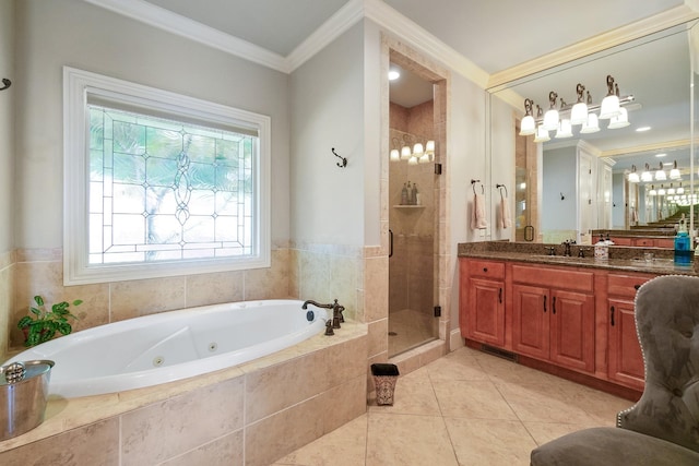 bathroom featuring plus walk in shower, vanity, ornamental molding, and tile patterned flooring