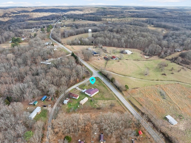 birds eye view of property with a rural view