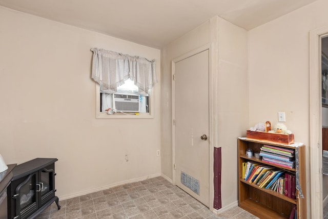 interior space with a wood stove and cooling unit