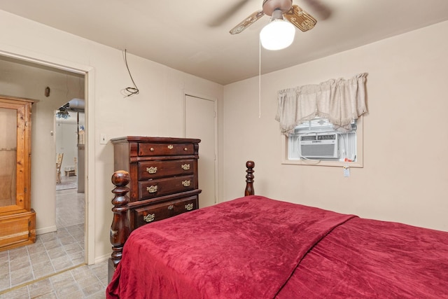 bedroom with ceiling fan and cooling unit