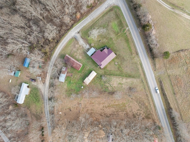 birds eye view of property with a rural view