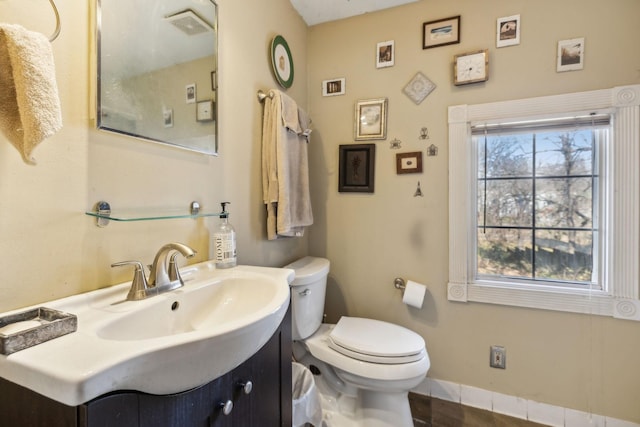 bathroom featuring vanity and toilet