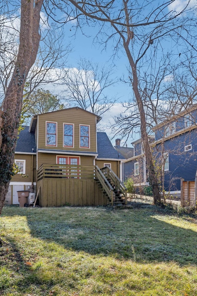 back of house with a lawn