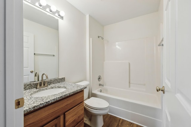 full bathroom featuring wood-type flooring, vanity, toilet, and shower / bathtub combination