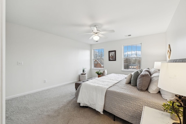 bedroom with ceiling fan and carpet floors