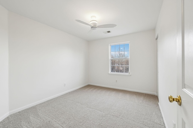 unfurnished room with carpet flooring and ceiling fan