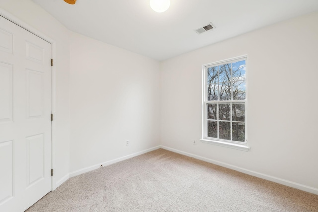 spare room featuring carpet floors