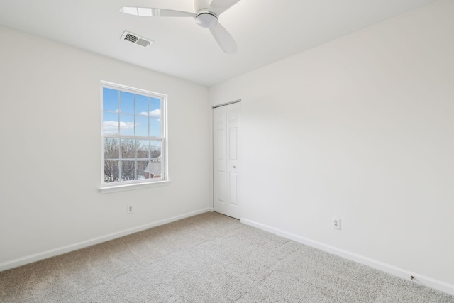 unfurnished room featuring carpet and ceiling fan