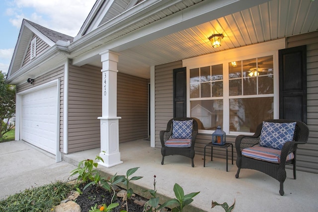 view of patio with covered porch and a garage