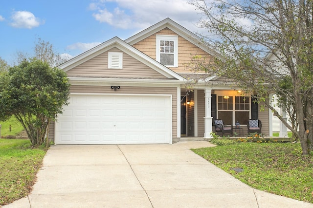 craftsman inspired home featuring a porch and a garage