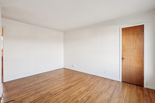 unfurnished room featuring light wood-type flooring