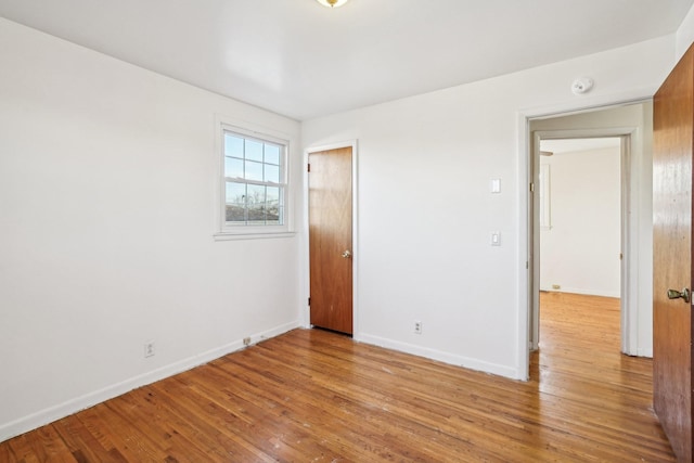 empty room with light hardwood / wood-style floors