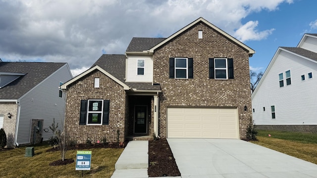 view of front property with a garage and a front lawn