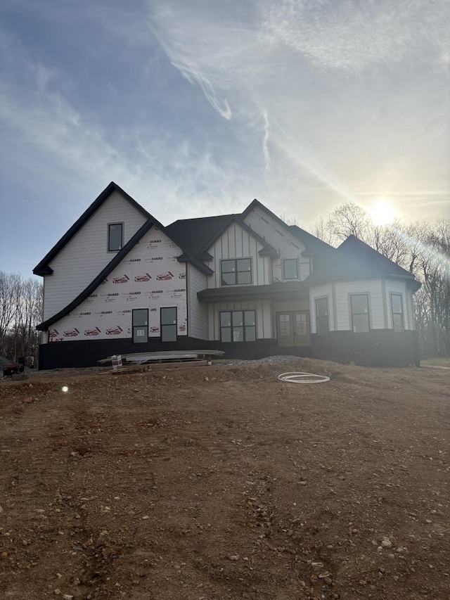 view of front of house featuring board and batten siding and french doors