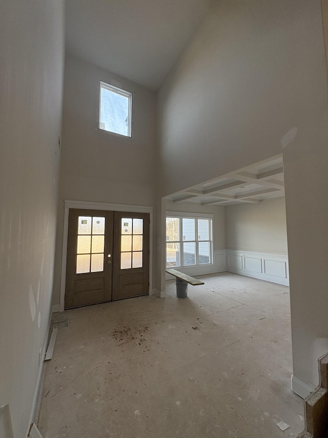 entrance foyer with french doors and a towering ceiling