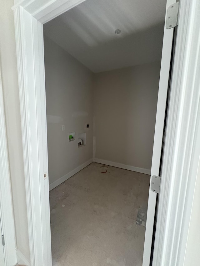 washroom with baseboards, hookup for an electric dryer, washer hookup, and laundry area