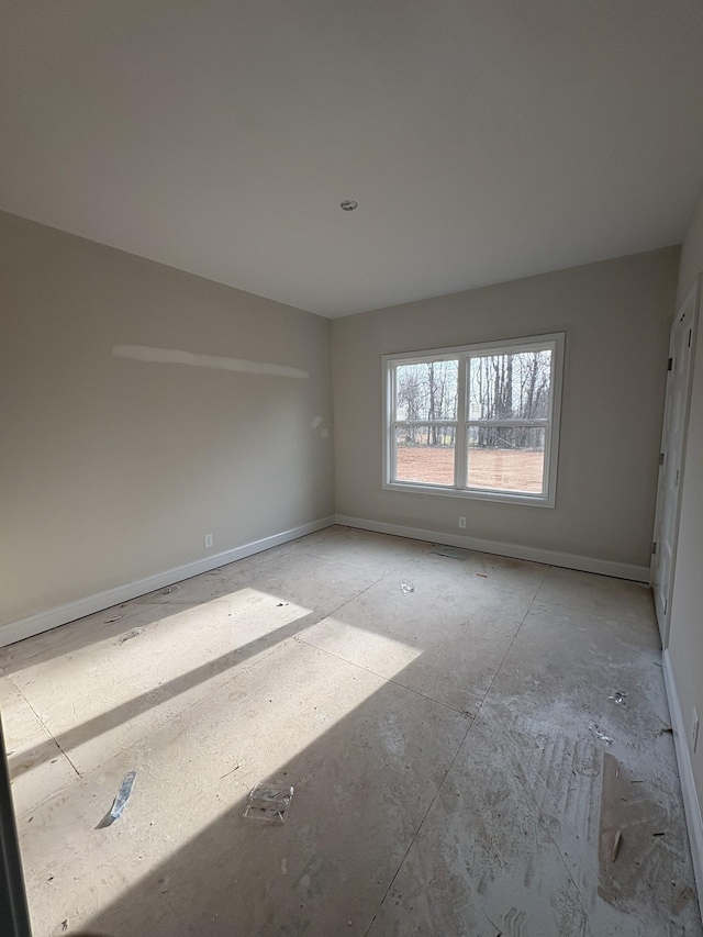 empty room with baseboards