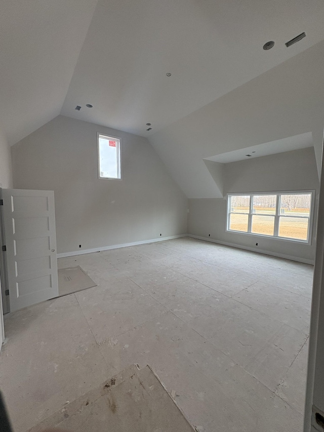 additional living space with vaulted ceiling