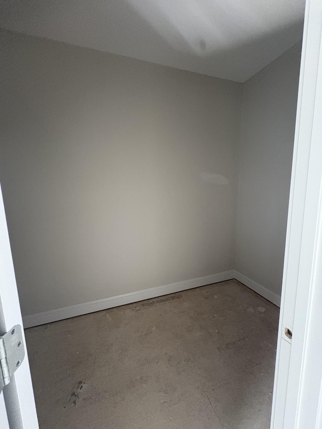 spare room featuring baseboards