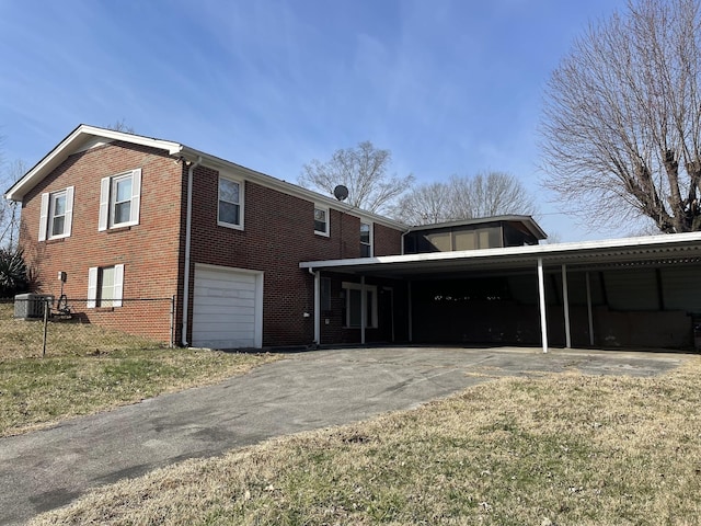 view of home's exterior featuring a garage and a carport