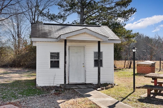 view of outdoor structure with a lawn