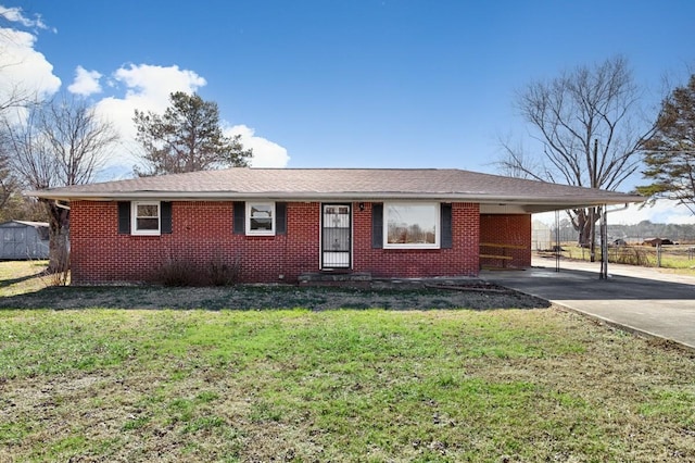 ranch-style house with a carport and a front lawn