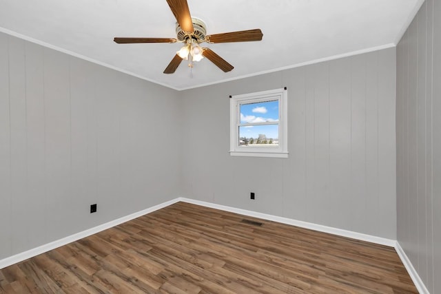 unfurnished room with hardwood / wood-style flooring, ceiling fan, and crown molding