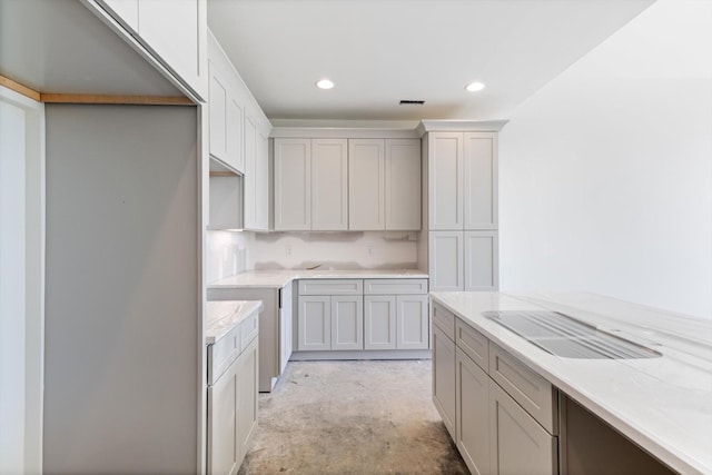 kitchen with light stone countertops