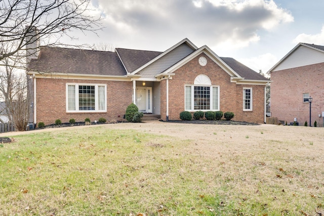 ranch-style house with a front lawn