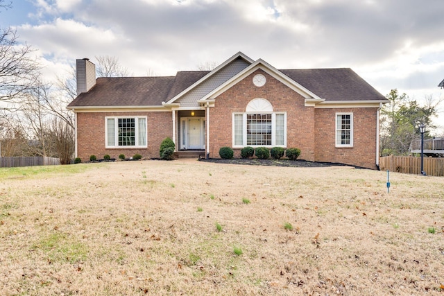 ranch-style home with a front yard