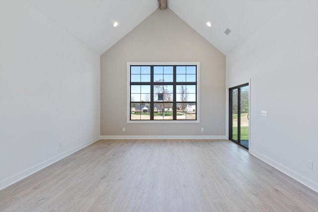 unfurnished room featuring beam ceiling, light hardwood / wood-style floors, and high vaulted ceiling