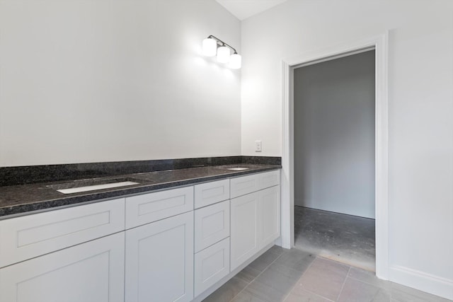 bathroom featuring tile patterned floors and vanity