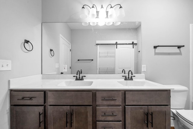 bathroom with vanity and toilet