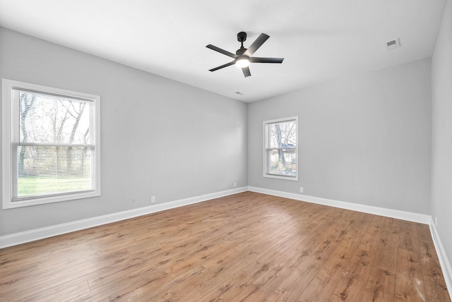 empty room featuring light hardwood / wood-style flooring and ceiling fan