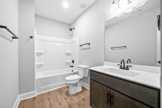 full bathroom with vanity, wood-type flooring,  shower combination, and toilet