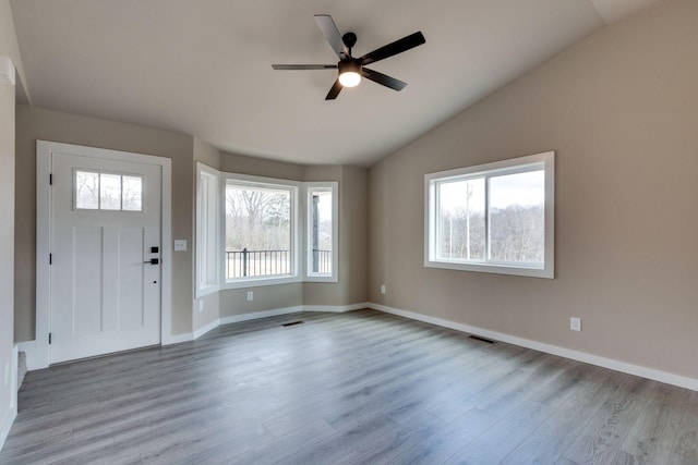 entryway with light hardwood / wood-style flooring, ceiling fan, and lofted ceiling