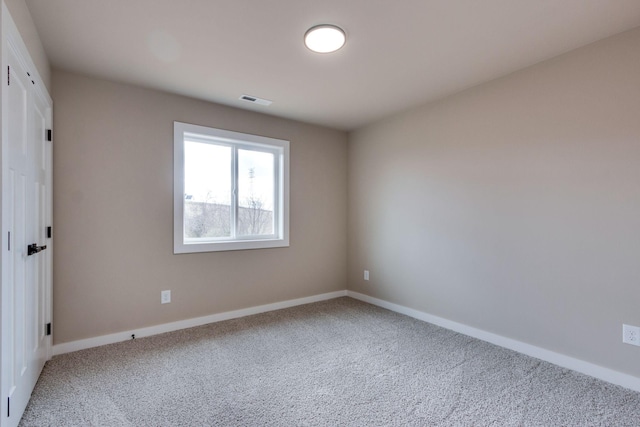 unfurnished room with carpet flooring